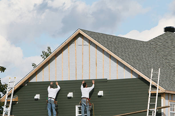 Professional Storm Damage Siding Repair technician working in Hilliard, OH
